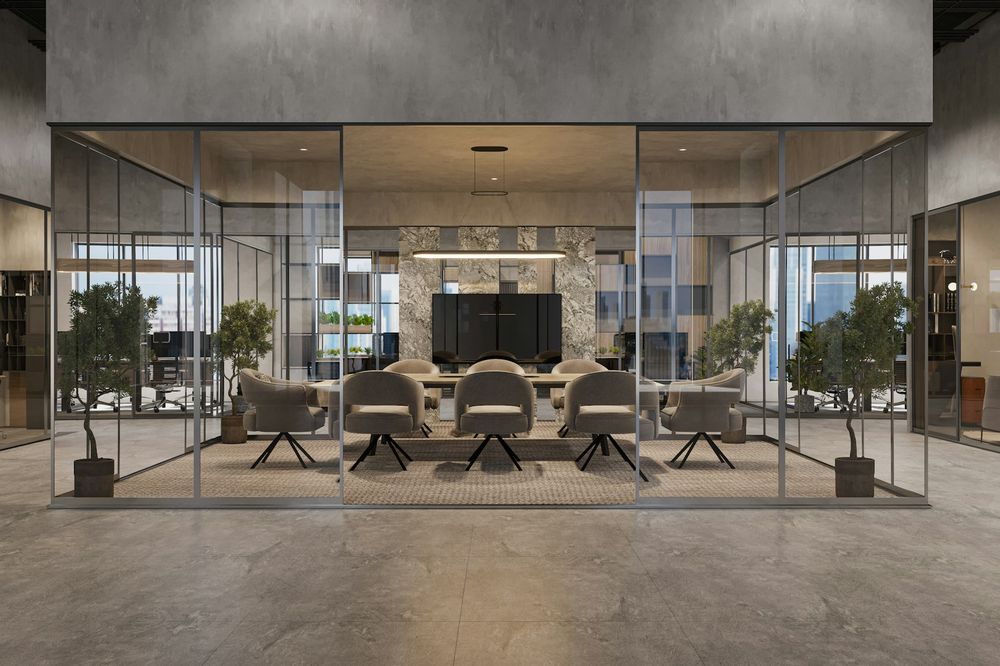 Glass-walled meeting room with upholstered chairs around a long table