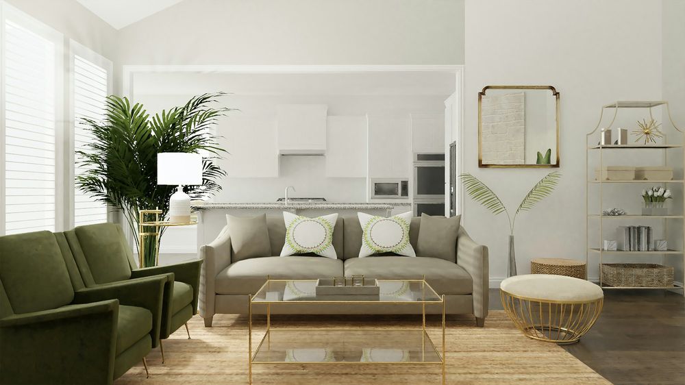 A bright living room with green armchairs, a pale sofa and an open kitchen behind