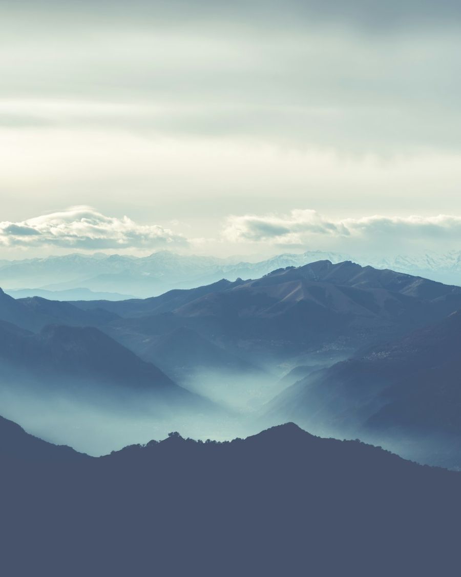 Blue mountain ranges with mist lying in the valleys